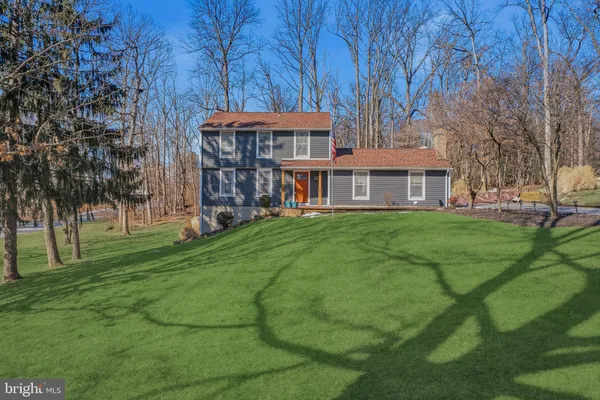 a view of a building with a yard