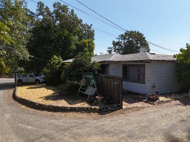 a view of backyard with trampoline