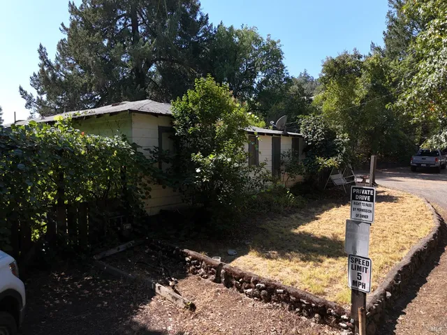 a backyard of a house with lots of green space