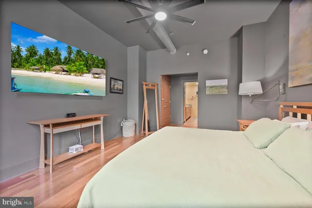 a bedroom with a bed and a fireplace