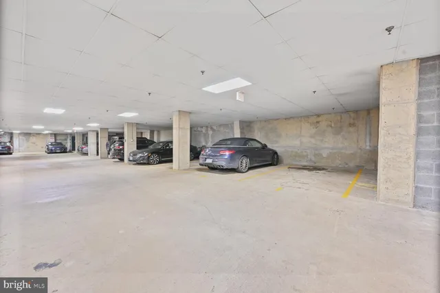 a living room with furniture and a glass door
