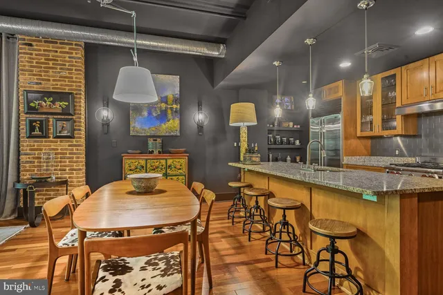 a kitchen with a table and chairs in it