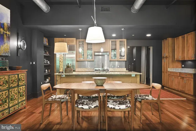 a view of a dining room with furniture and wooden floor