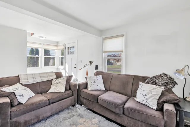 a living room with furniture and a couch