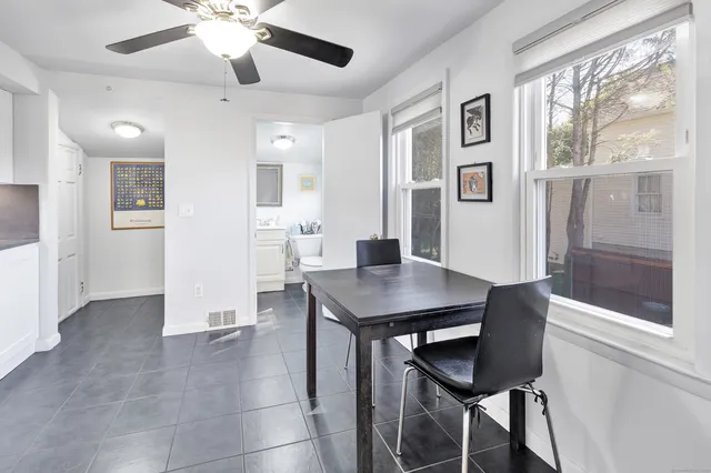 a view of a livingroom with furniture and window