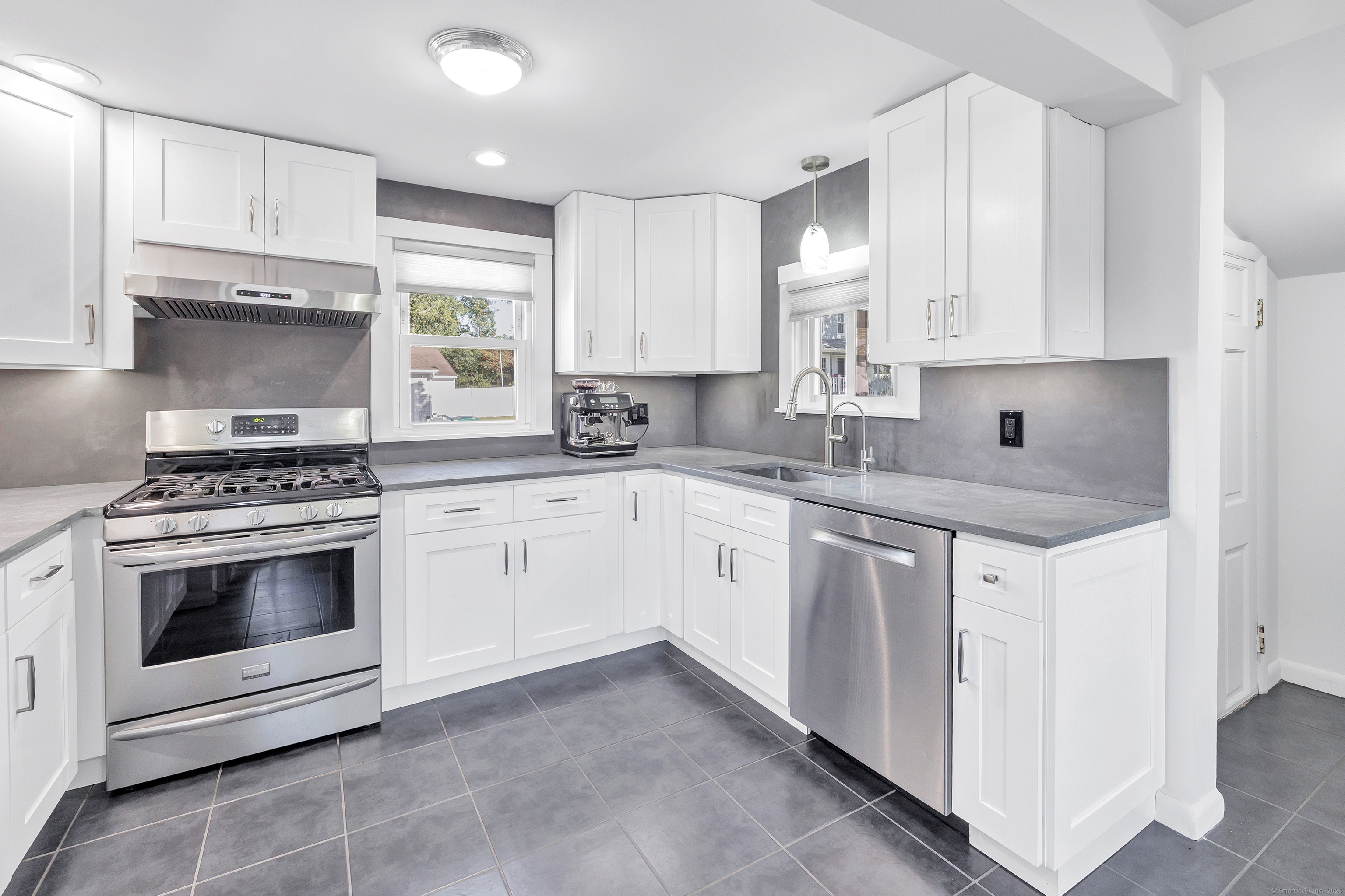 700 Huntington Road Stratford, CT 06614 - Photo 21 of 33 a kitchen with cabinets appliances a sink and a window