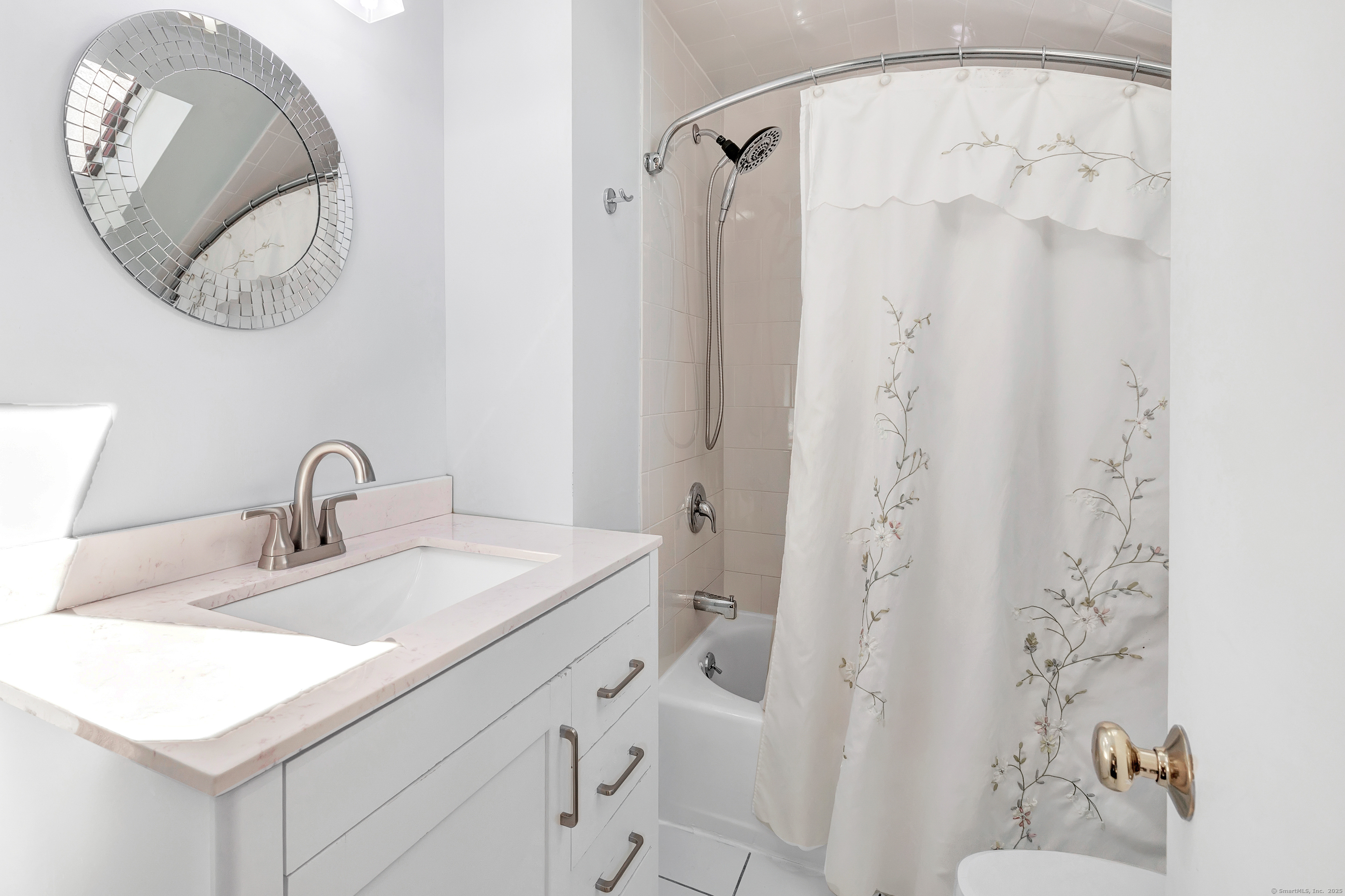 700 Huntington Road Stratford, CT 06614 - Photo 28 of 33 a bathroom with a sink and a mirror