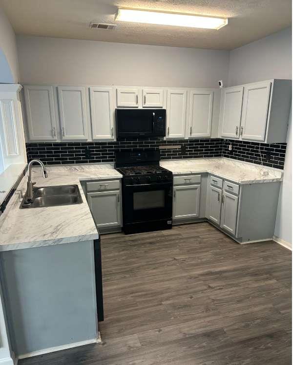 5103 Jack Drive Decatur, GA 30035 - Photo 6 of 34 a kitchen with granite countertop a sink and stainless steel appliances