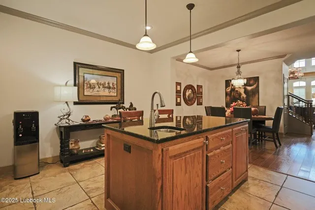 a kitchen with stainless steel appliances granite countertop a sink and cabinets