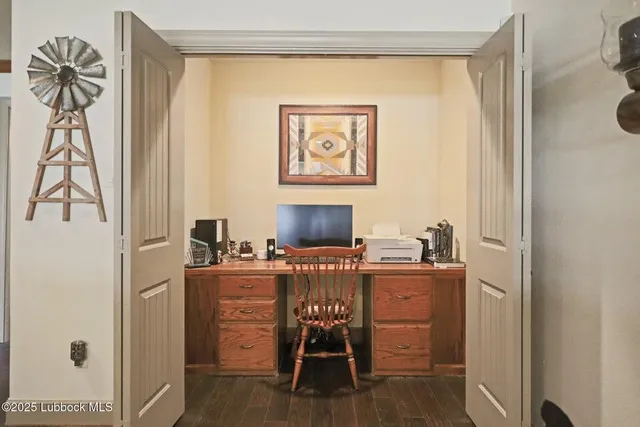 a workspace with furniture and a window