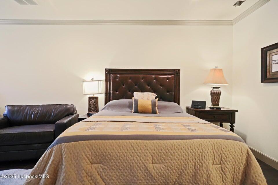 4501 19th Street, Unit 6 Lubbock, TX 79407 - Photo 19 of 44 a bedroom with bed and a couch