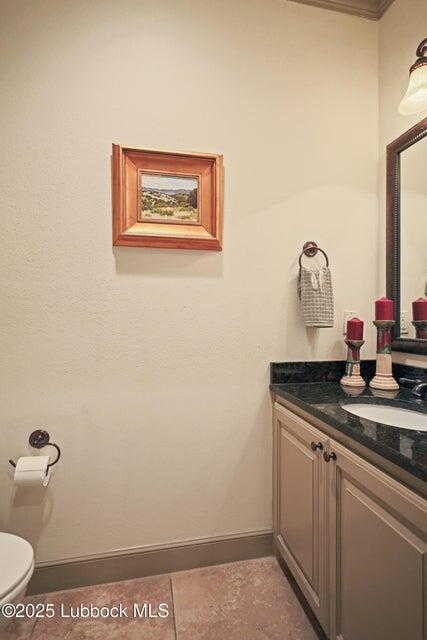 4501 19th Street, Unit 6 Lubbock, TX 79407 - Photo 40 of 44 a bathroom with a granite countertop sink and a mirror