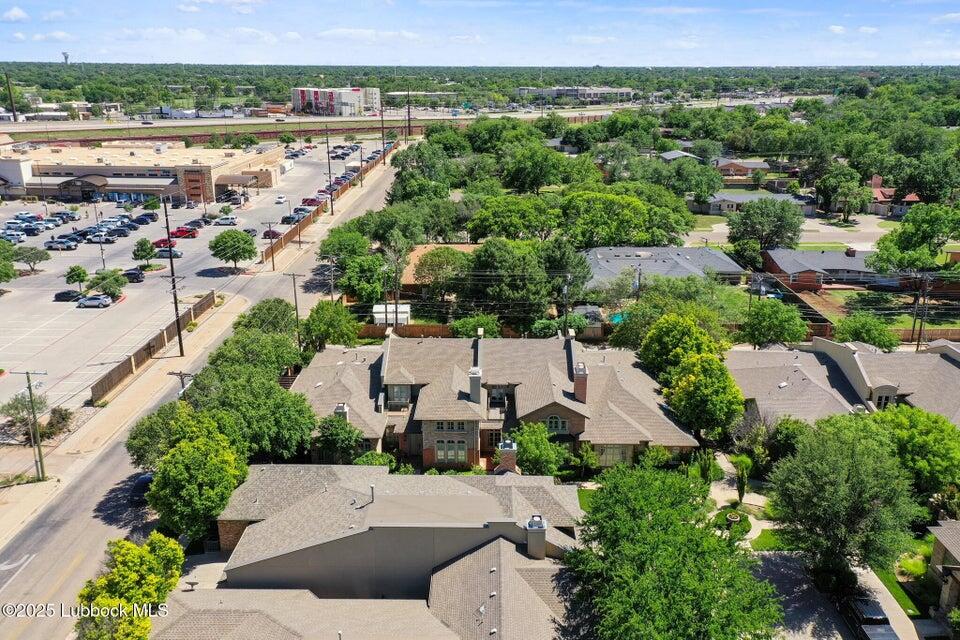 4501 19th Street, Unit 6 Lubbock, TX 79407 - Photo 44 of 44 an aerial view of a house with a yard