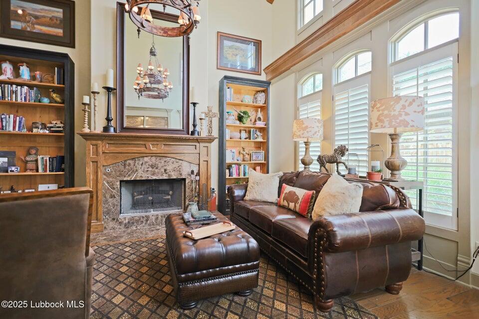 4501 19th Street, Unit 6 Lubbock, TX 79407 - Photo 7 of 44 a living room with furniture and a fireplace