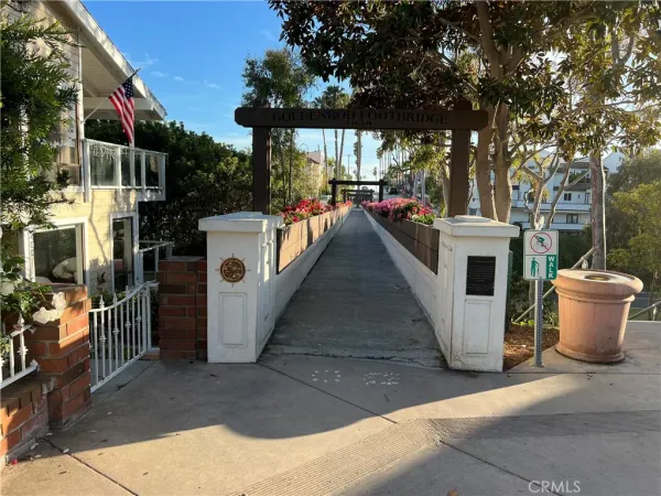 a view of a patio with table and chairs potted plants
