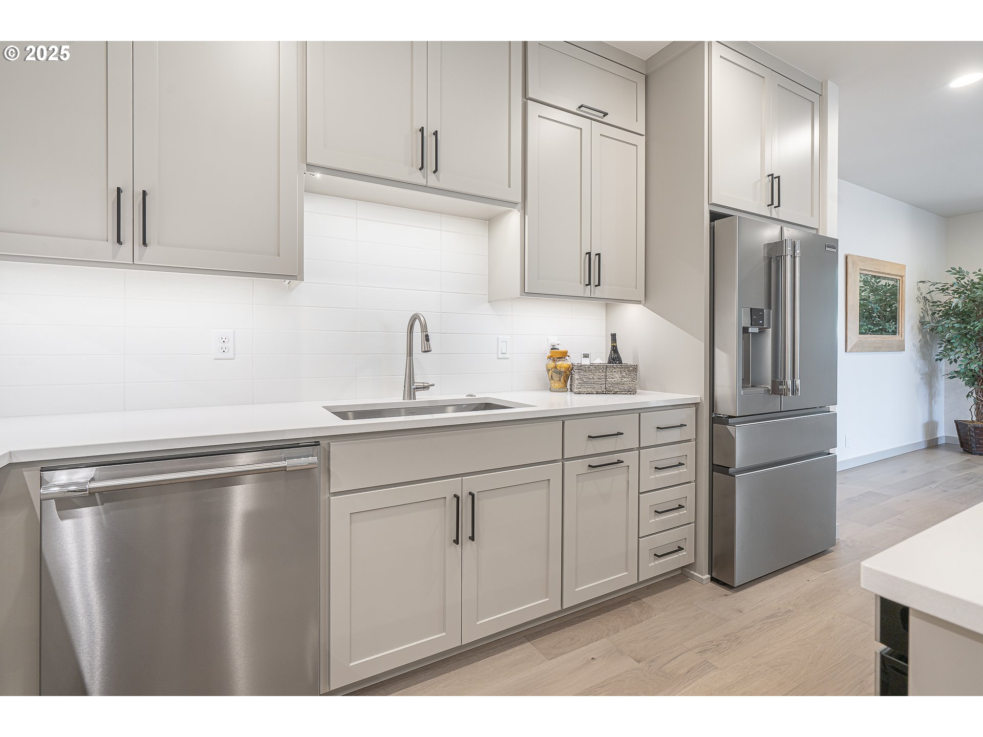 955 Oak Meadows Place Springfield, OR 97477 - Photo 11 of 37 a kitchen with stainless steel appliances granite countertop a refrigerator sink and cabinets