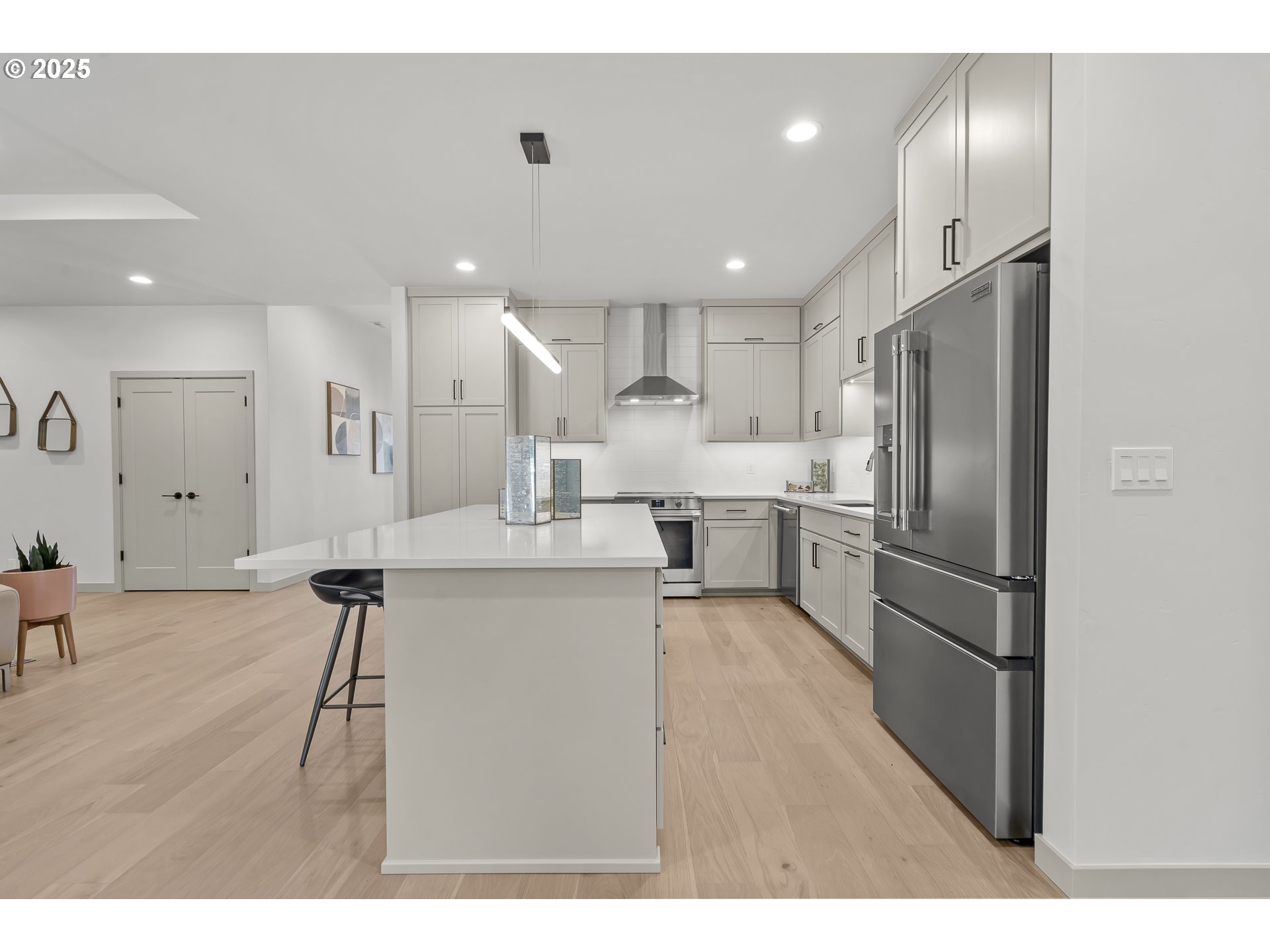 955 Oak Meadows Place Springfield, OR 97477 - Photo 12 of 37 a kitchen with kitchen island stainless steel appliances sink refrigerator and microwave
