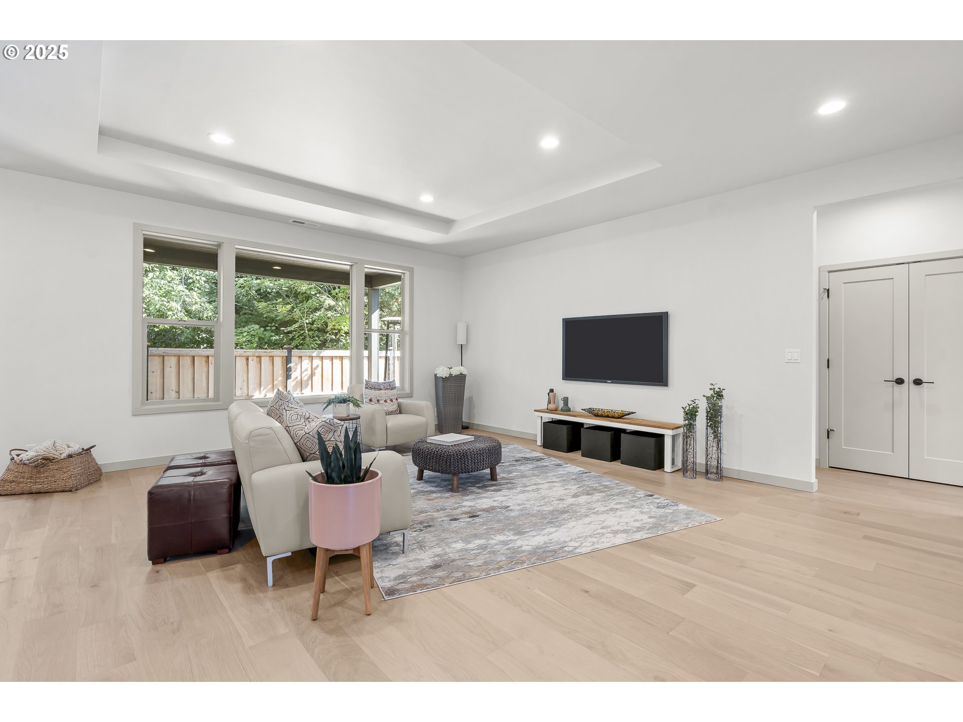 955 Oak Meadows Place Springfield, OR 97477 - Photo 3 of 37 a living room with furniture a flat screen tv and a large window