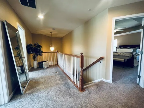 a view of a livingroom with furniture and staircase