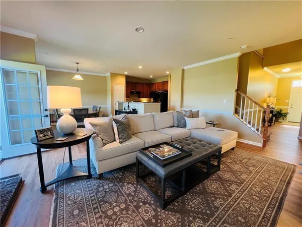 a living room with furniture and a rug