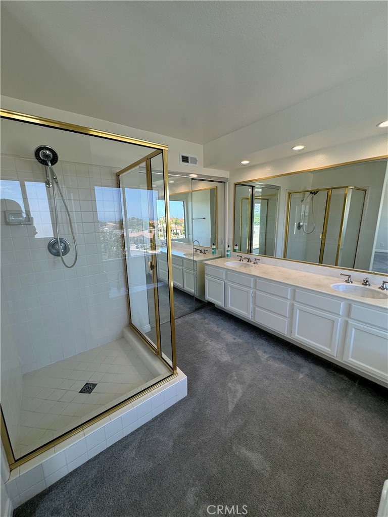 25 St Kitts Dana Point, CA 92629 - Photo 13 of 14 a bathroom with a tub and shower
