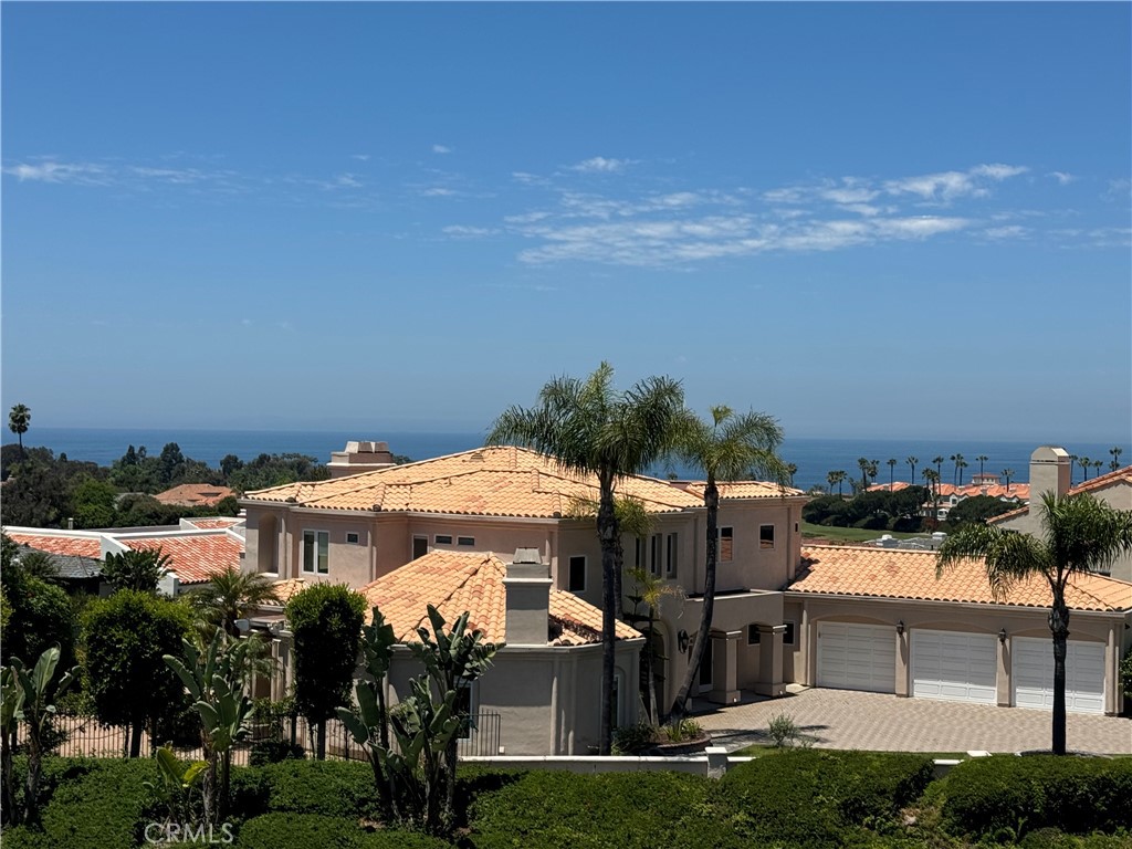 25 St Kitts Dana Point, CA 92629 - Photo 9 of 14 a front view of a house with a yard and seating area