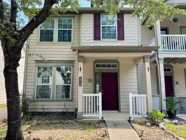 a front view of a house with a porch