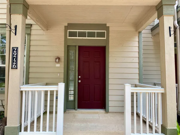 a front view of a house with a porch