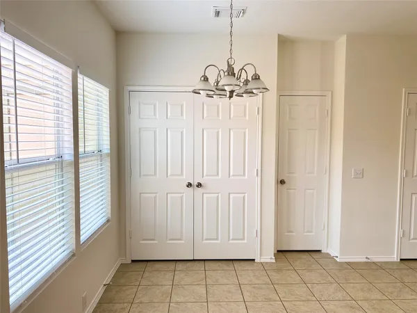 a view of a hallway with windows