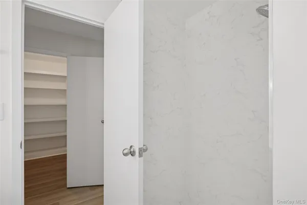 a view of a room with wooden floor