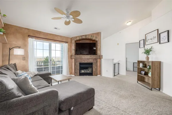 a living room with a fireplace