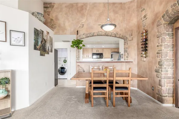 a kitchen with a sink stove and microwave