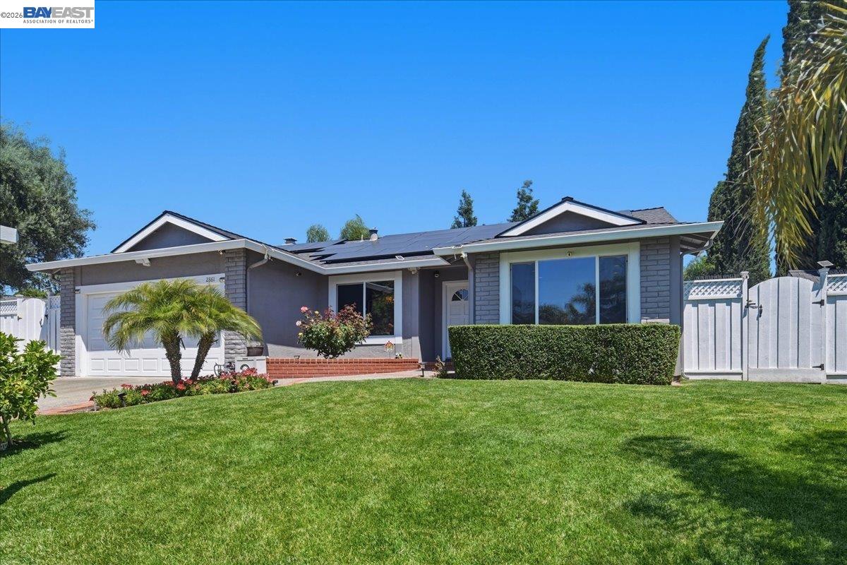 2861 Millbridge Place San Ramon, CA 94583 - Photo 2 of 58 a front view of a house with a yard and potted plants