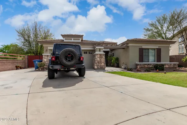 a view of a car parked in back of a house