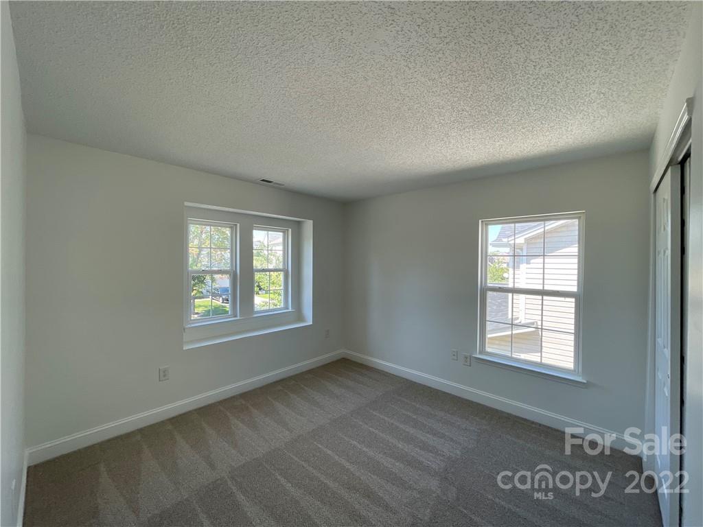 13712 Rutherglen Court Charlotte, NC 28213 - Photo 15 of 22 an empty room with a window