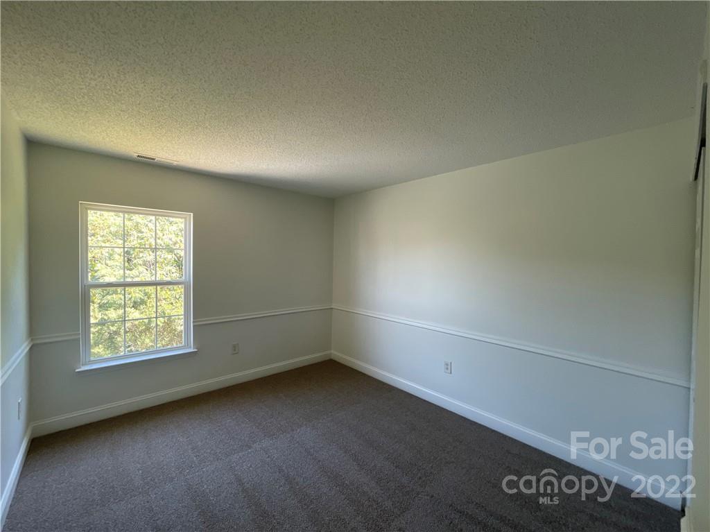 13712 Rutherglen Court Charlotte, NC 28213 - Photo 18 of 22 an empty room with a window