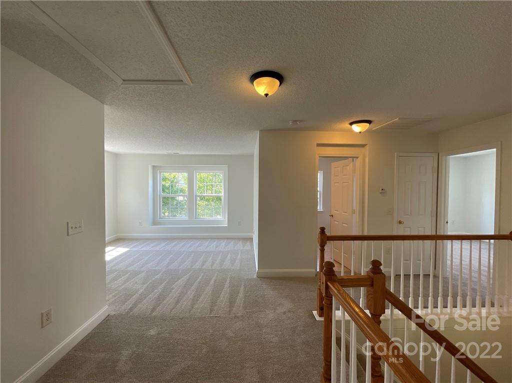 13712 Rutherglen Court Charlotte, NC 28213 - Photo 20 of 22 a view of an empty room and window