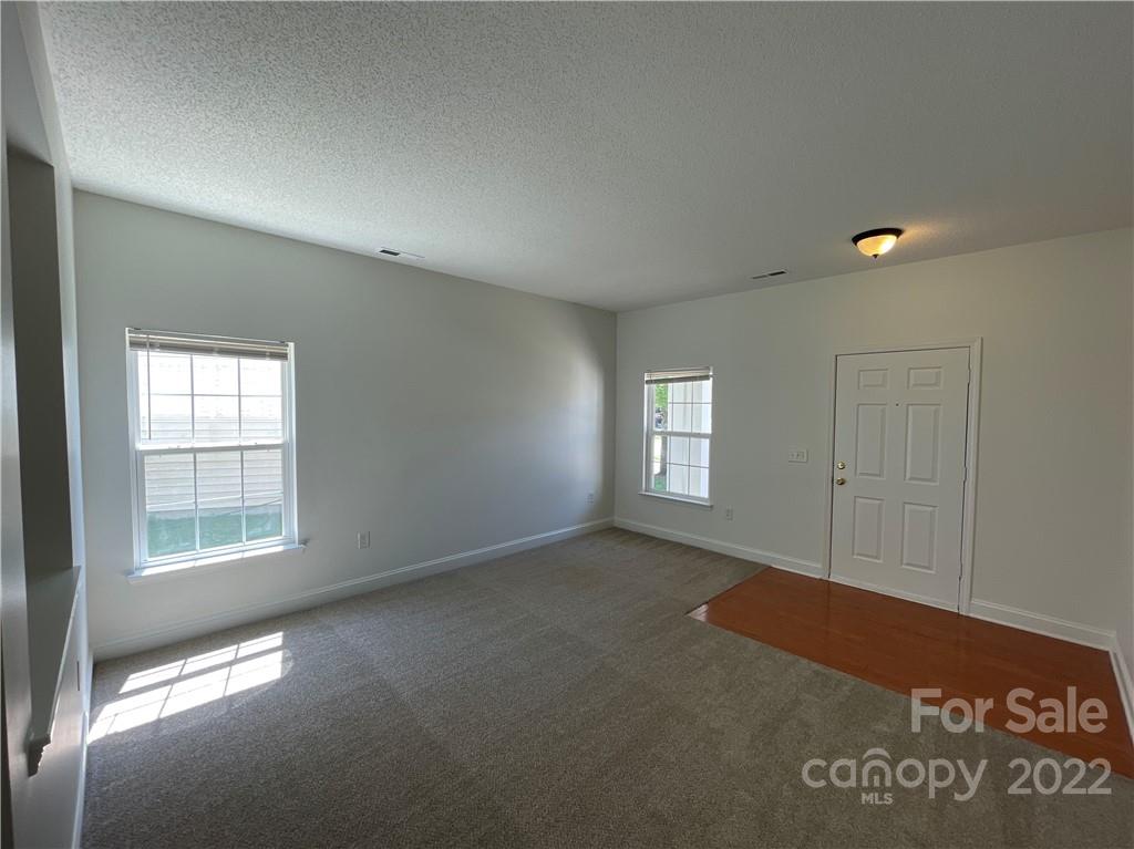 13712 Rutherglen Court Charlotte, NC 28213 - Photo 2 of 22 an empty room with windows