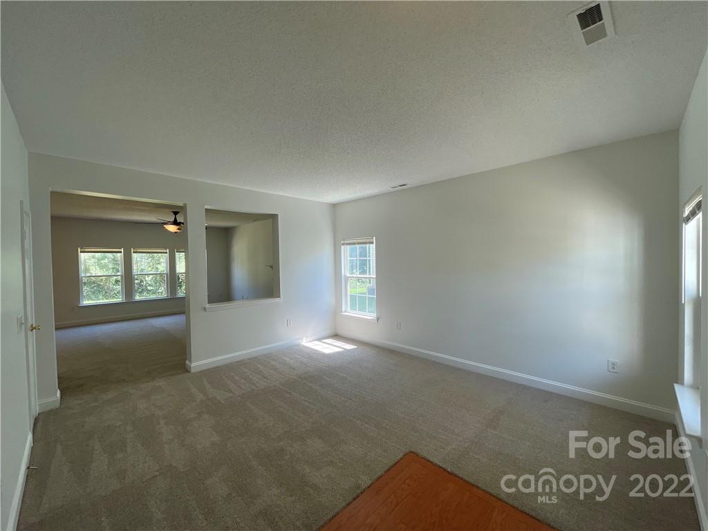 13712 Rutherglen Court Charlotte, NC 28213 - Photo 3 of 22 an empty room with windows