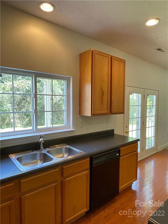 13712 Rutherglen Court Charlotte, NC 28213 - Photo 10 of 22 a kitchen that has a sink and a chair