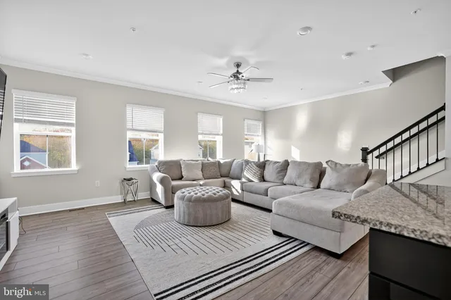 a living room with furniture and a table
