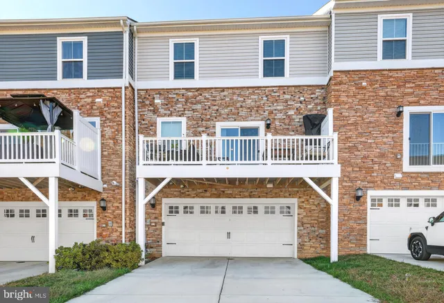 front view of a house with a fence