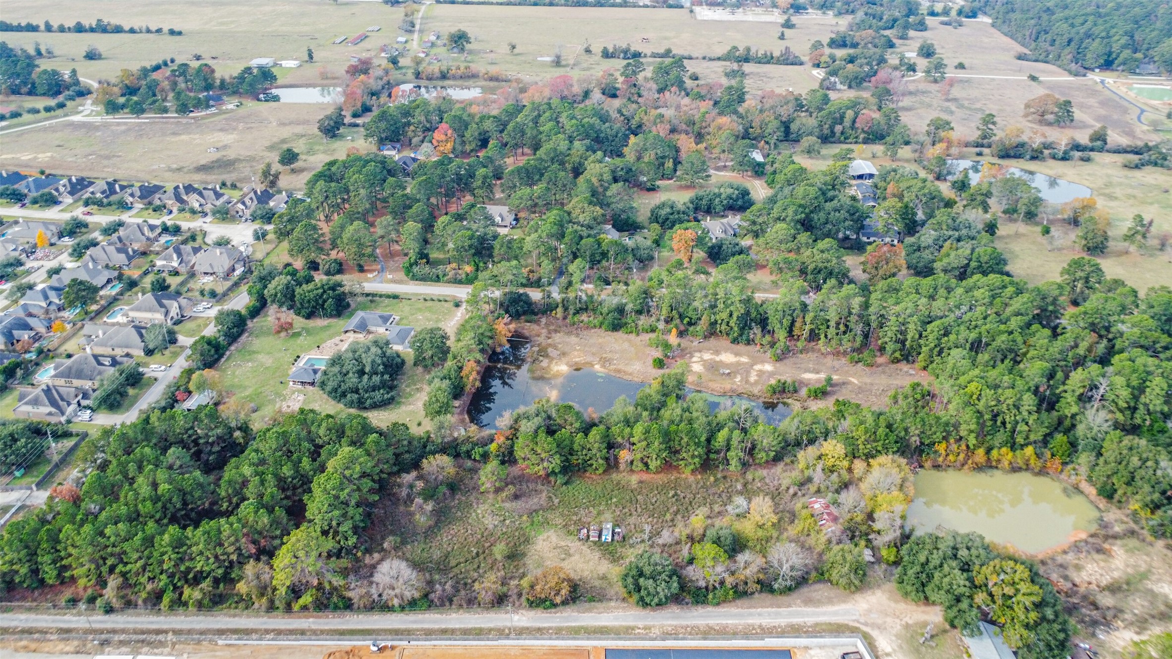 22422 Tomball Cemetery Road Tomball, TX 77377 - Photo 4 of 17 an aerial view of residential houses with outdoor space and trees all around