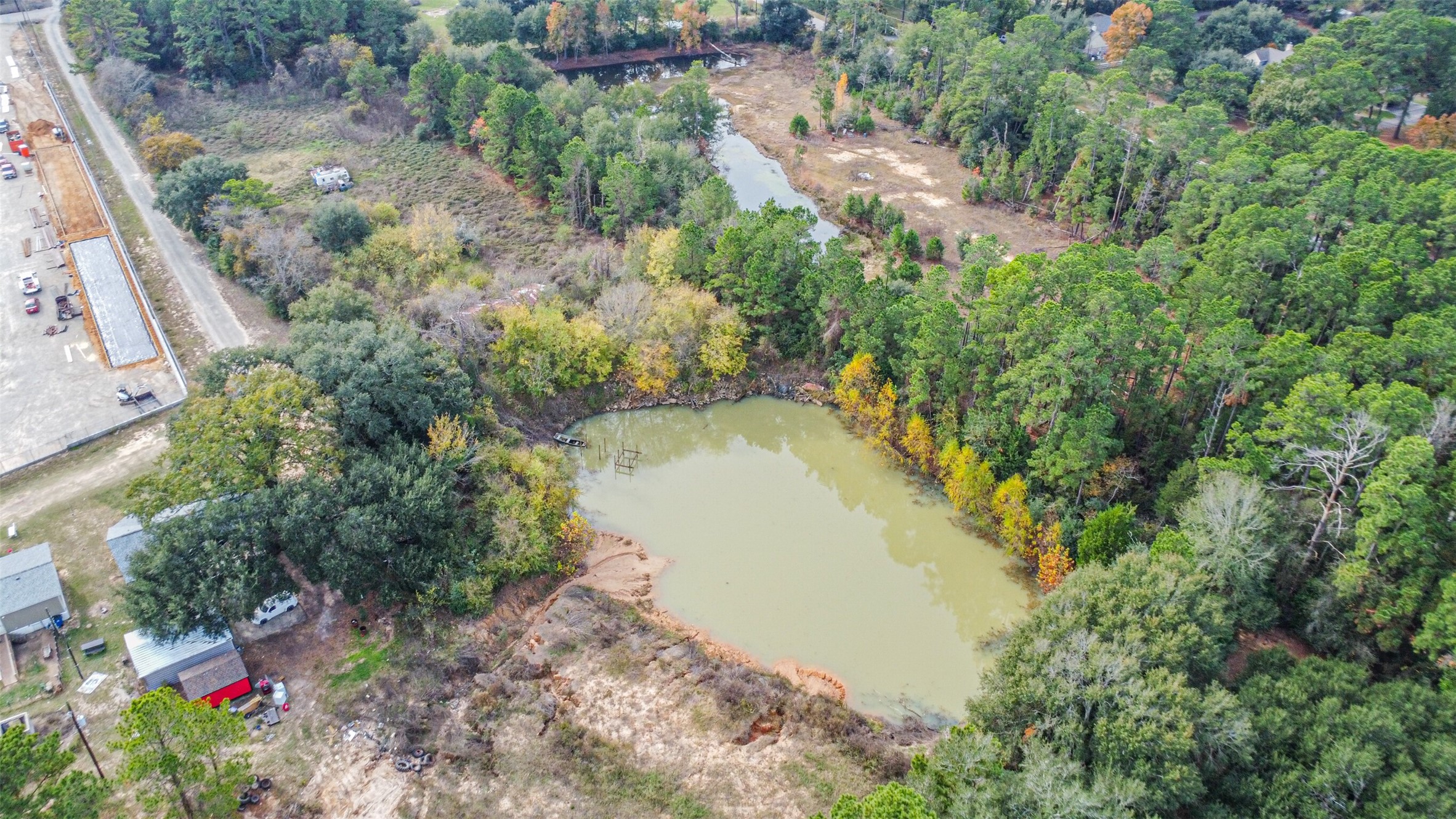 22422 Tomball Cemetery Road Tomball, TX 77377 - Photo 9 of 17 an aerial view of a house with a yard and lake view