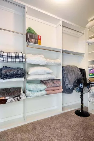 a bathroom with a double vanity sink and a shower