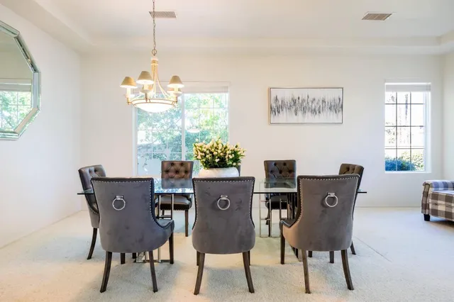 a view of a dining room with furniture window and outside view