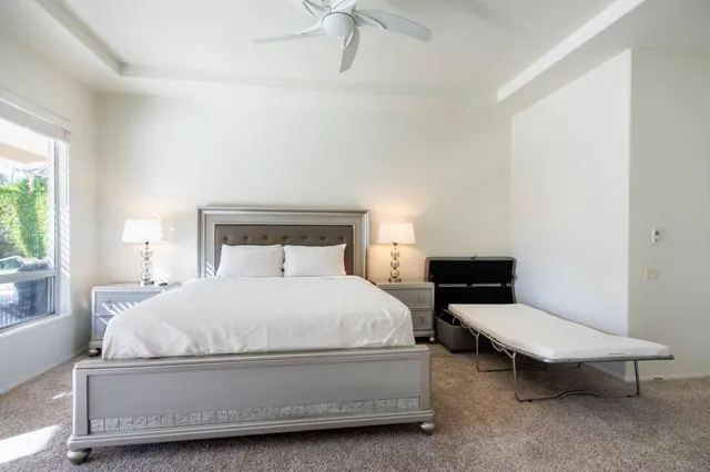 a bathroom with a sink double vanity mirror and a bathtub