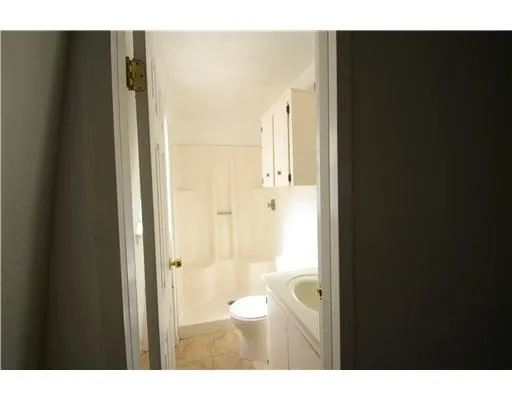 a bathroom with a granite countertop sink