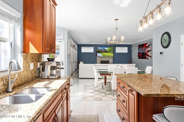 a kitchen with a sink cabinets and window