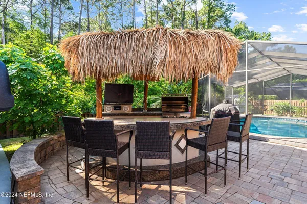 a patio with table and chairs